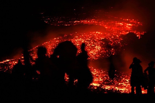 Tourists stood in front of Guatemalas Pacaya volcano.